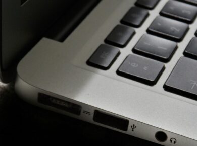 Free Detailed view of a silver laptop showing keyboard and multiple ports. Stock Photo