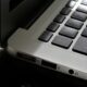 Free Detailed view of a silver laptop showing keyboard and multiple ports. Stock Photo